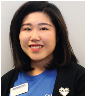 Smiling young woman wearing a black cardigan